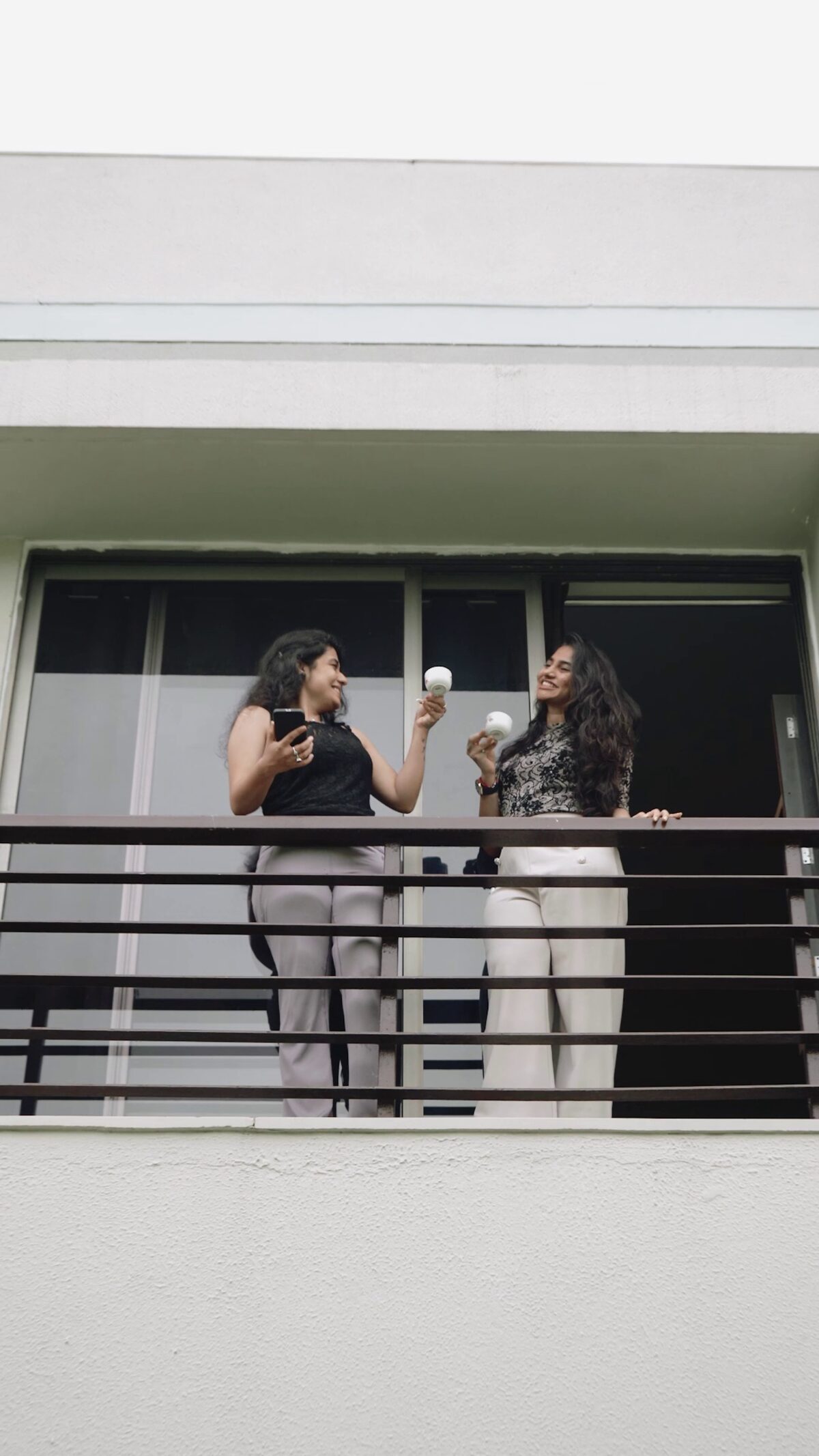Guests toasting on the balcony